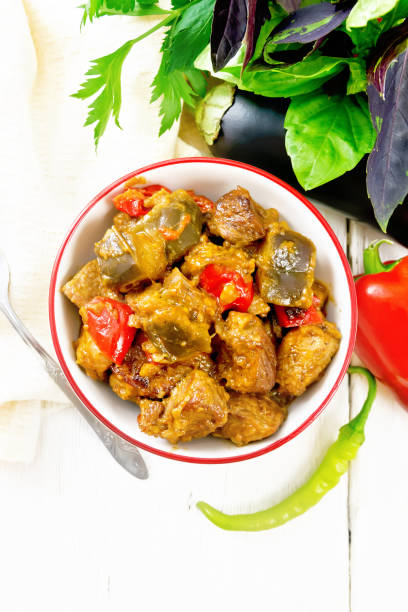 istock Meat with eggplant and pepper in bowl on board top 1394758718