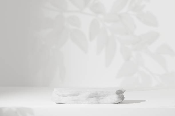 istock Empty stone pedestal or podium with sunny shadow in blank studio or room. Minimal and nature scene backdrops for product display. 3D Rendering. 1394763507
