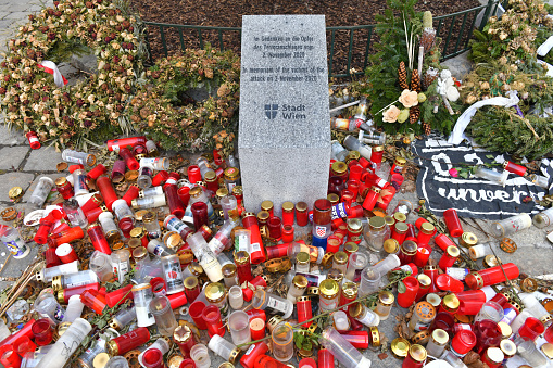 Memorial stone and many candles for the victims of the terrorist attack in Vienna on November 2, 2020, Austria