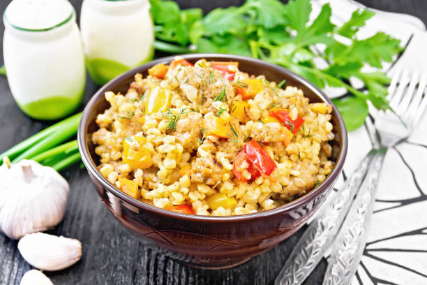istock Barley porridge with minced meat in bowl on dark board 1394764549
