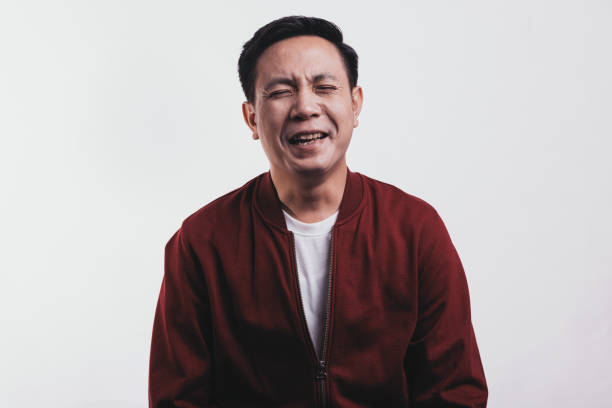istock Asian man portait, laughing. 1394764635