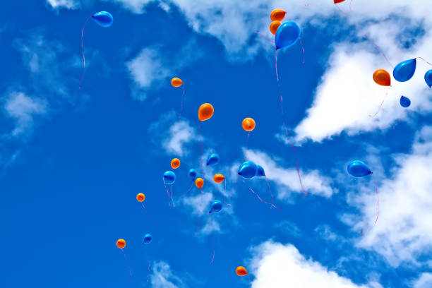 Many colorful balloons in the clear sky