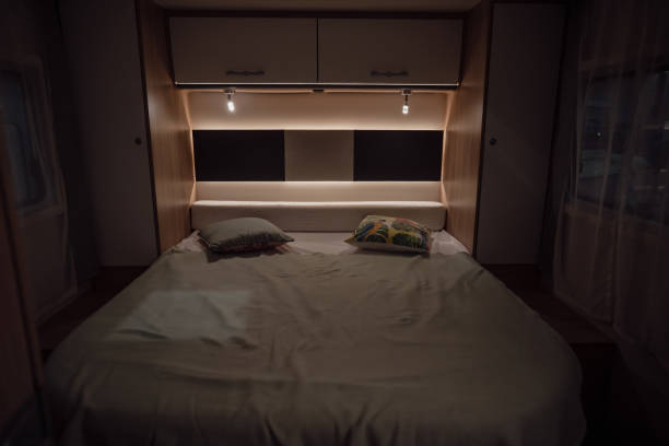 istock Bed inside a new luxury camper van motorhome 1394768917