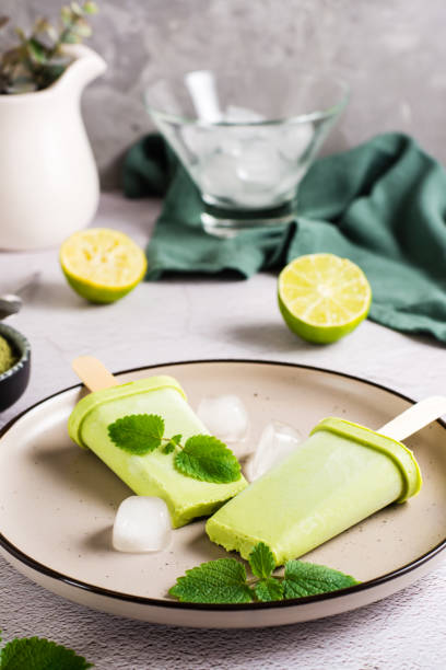 istock Vegetarian popsicle made from matcha tea, coconut milk and mint on a plate. Vertical view. Close-up 1394769141