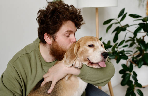istock Man kissing his lovely dog 1394772184