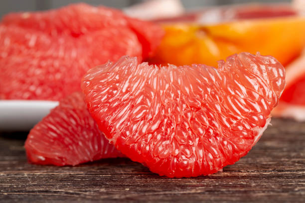 istock peeled and divided into parts ripe red grapefruit 1394772927