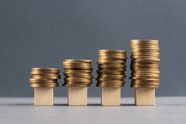 istock Wooden blocks and coins 1394773337