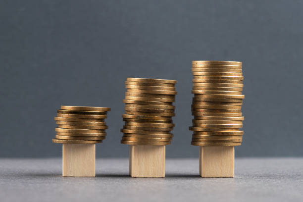 istock Wooden blocks and coins 1394773390