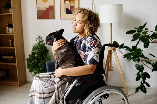 istock Woman with disability holding her dog 1394774540