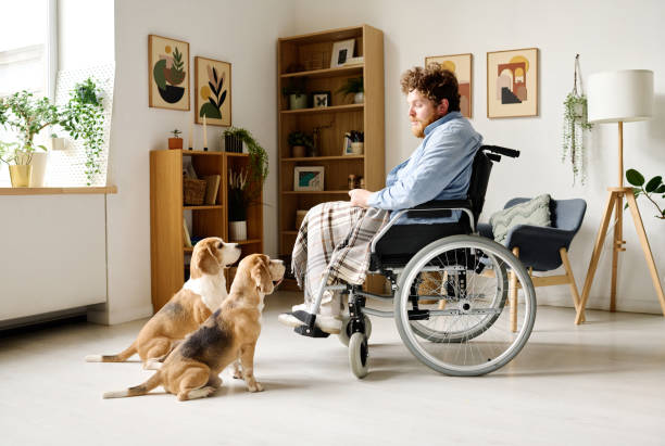istock Man with disability talking with dogs 1394774709
