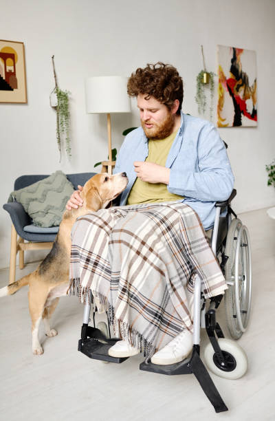 istock Man with disability getting rid of his depression with dog 1394774727
