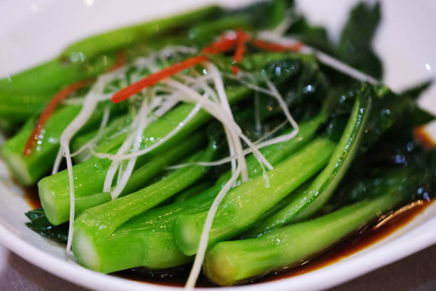 close up Sauteed Choy Sum in plate. Stir-fried Chinese flowering cabbage