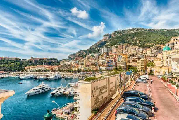 View over luxury yachts and apartments of Port Hercules in La Condamine district, city centre and harbour of Monte Carlo, Cote d'Azur, Principality of Monaco, iconic landmark of the French Riviera