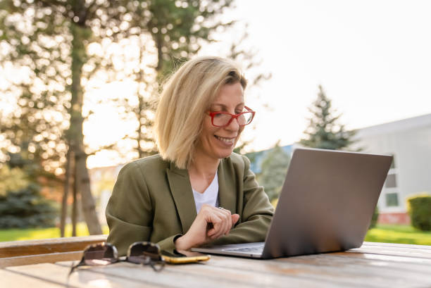 istock Casual Business Woman, outdoor, using mobile devices 1394777705