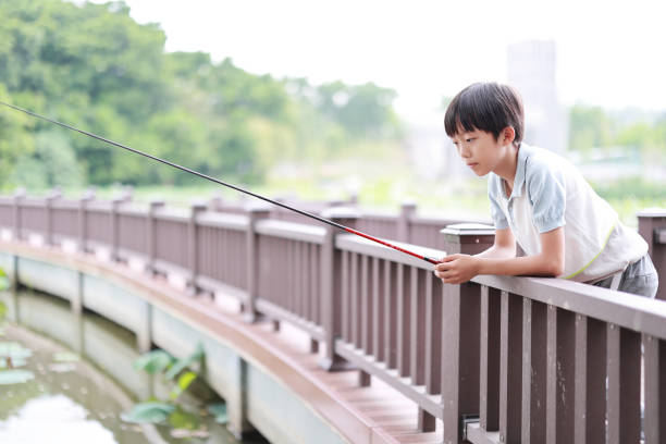 Little Boy Learning to Fish