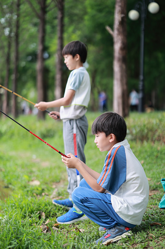 Little Boy Learning to Fish