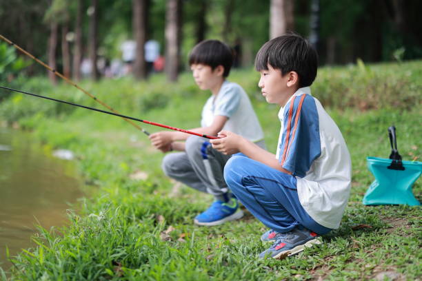 Little Boy Learning to Fish