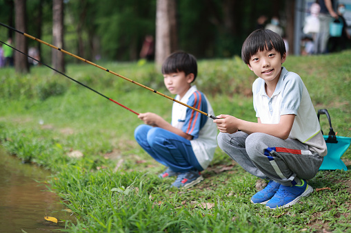 Little Boy Learning to Fish