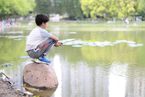 Little Boy Learning to Fish
