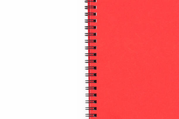 istock Spiral notebook with red cover on white background 1394781292