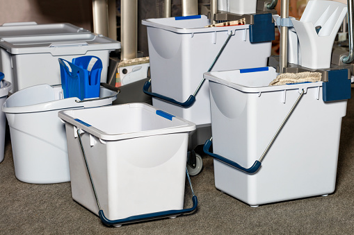 Plastic buckets buckets with wringer, frame, mop as part of a professional cleaning system for small areas for quick and ergonomic cleaning of rooms with high performance.
