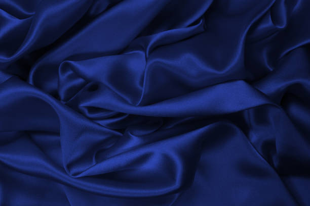 istock Purple silk or satin luxury fabric texture can use as abstract background. 1394784189