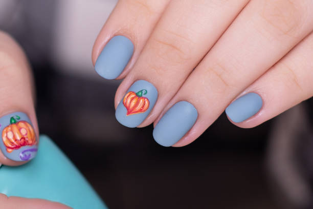 istock Female hands whith blue manicure nails 1394784511