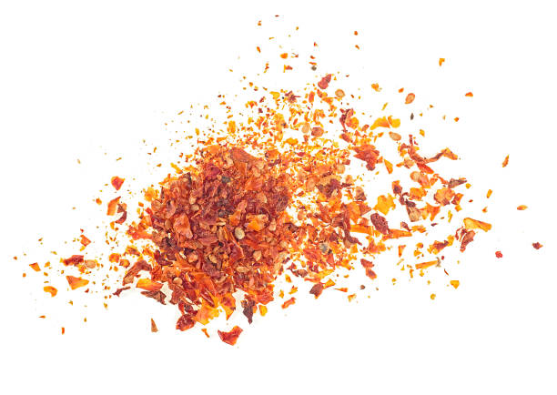 istock Dried and chopped tomatoes isolated on a white background, top view. Tomato flakes. 1394785531