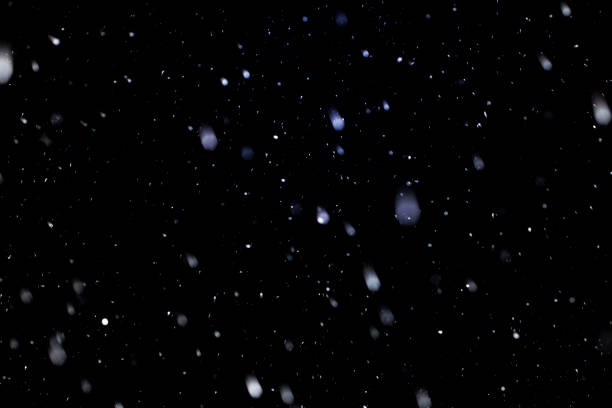 istock Real snow on black background, It is snowing, blend layer for screen, add 1394787659