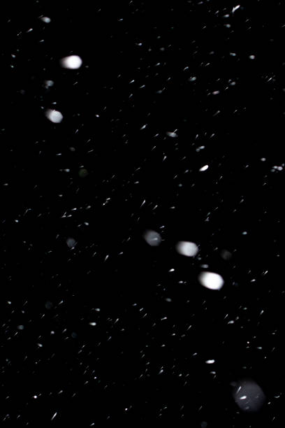 istock Real snow on black background, It is snowing, blend layer for screen, add 1394787660