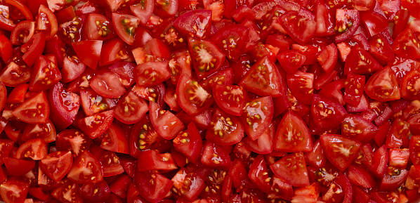 Full frame of chopped tomatoes can be used as a background