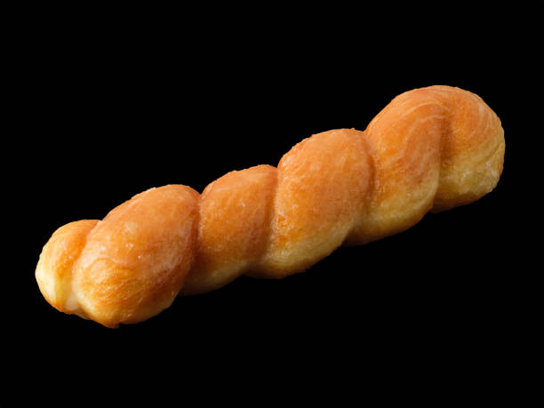 istock Donut - pigtail on a black background 1394788259
