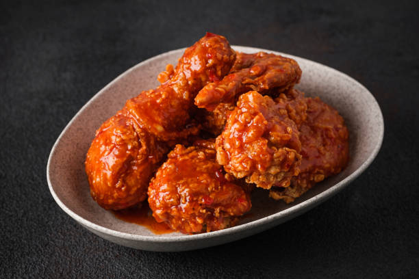 istock Korean fried chicken in spicy sauce 1394789300