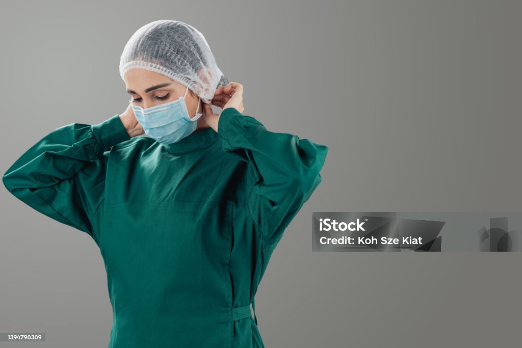 Portrait of an Indian woman in surgical wear Green Color Stock Photo