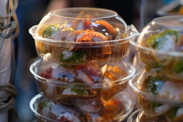 istock Stacked plastic dishes full of Thai confectionery 1394791942