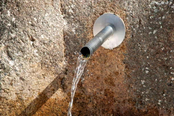 istock Water running on natural fountain 1394794615