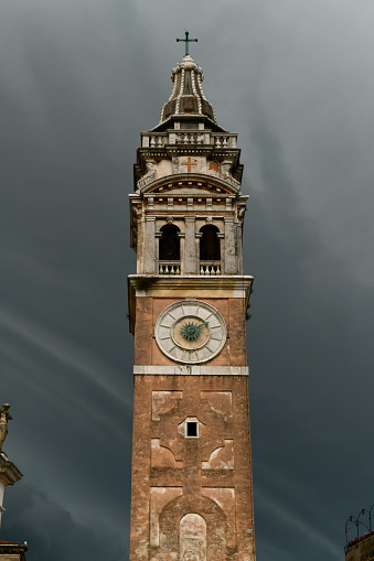 Campo and Chiesa Parrocchia di Santa Maria Formosa against a cloudy background in Venice, Italy.