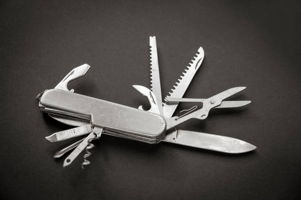istock Metallic swiss knife isolated on black 1394800888