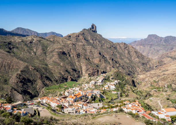 Tejeda village from above and impressive mountain landscape surroundings, Canary Islands, Spain. Roque Bentayga is at background