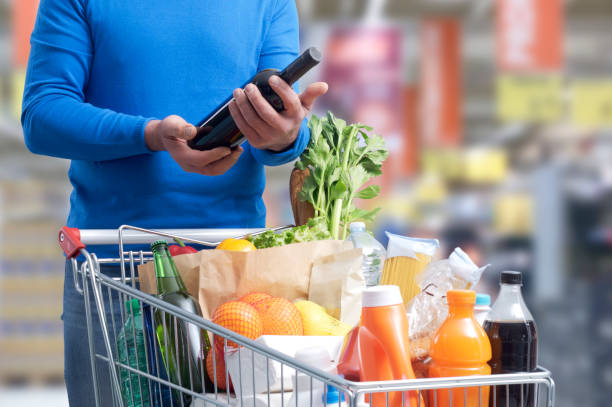 istock Man doing grocery shopping and buying wine 1394803604