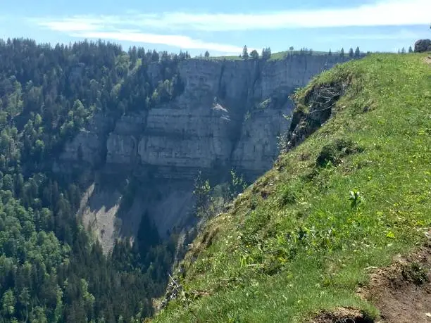 Switzerland - Canton of Neuchatel - The Creux-du-Van is a rocky cirque about 1,400 meters wide and 200 meters high. It is located on the territory of the locality of Gorgier, in the commune of La Grande Béroche, in the Littoral region, in the canton of Neuchâtel, in