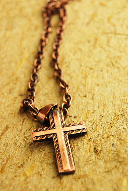 istock Metalic rosary over a cardboard rough surface 139480502
