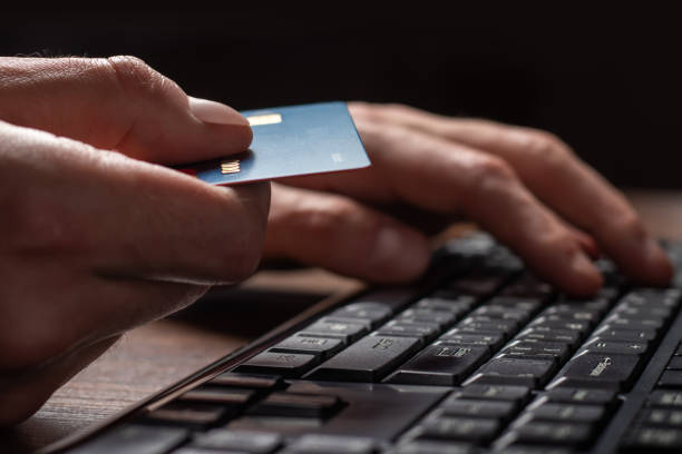 istock Hands holding credit card and using laptop. Online shopping 1394806894