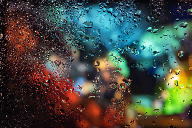 istock Condensation on the clear glass window. Water drops. Rain. Abstract background texture 1394806926