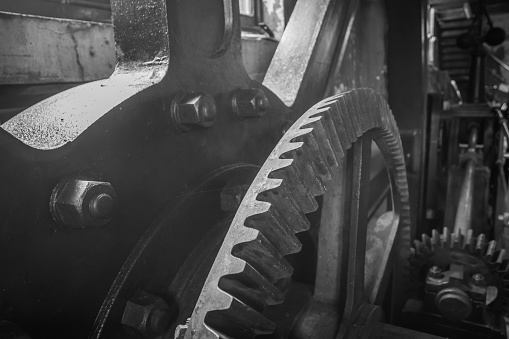 Mono show of the flywheel and gears of a steam engine