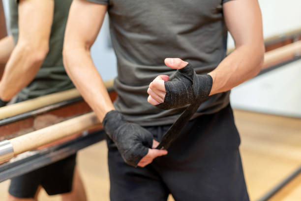 istock Crop male boxer bandaging hands 1394808444