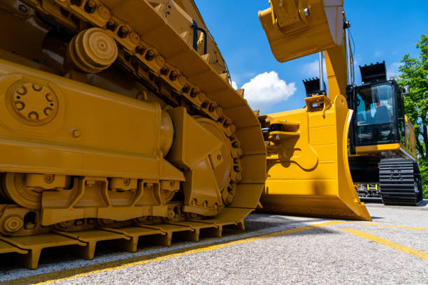 istock Bulldozer on the background of the excavator 1394809432