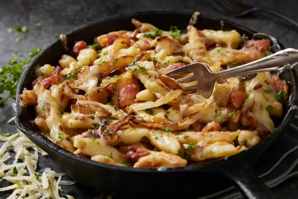 German Cheesy Fried Hand Made Spaetzle with Bacon and Emmental Cheese