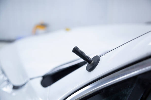 istock Installing a protective film on the car. 1394811201