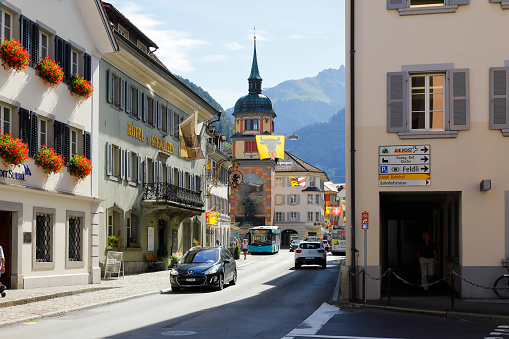 Altdorf, Switzerland - August 27, 2020: There is a street at the end of which is a large monument in honor of Wilhelm Tell, the folk hero of Switzerland.